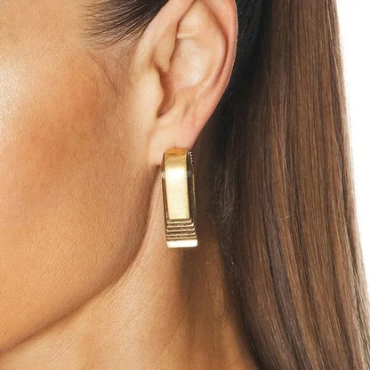 KHAITE Zucchini Earrings in Antique Gold